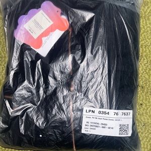 This is a Fabletics/Yitty Pet Me Heart Pocket Onesie. Size L